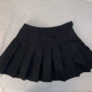 black pleated mini skirt